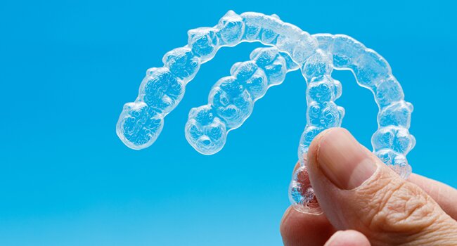 new-set-of-invisalign-aligners-which-is-provided-every-4-to-8-weeks-during-regular-check-ups-with-dentist-during-the-monitoring-progress-and-adjustment-phase